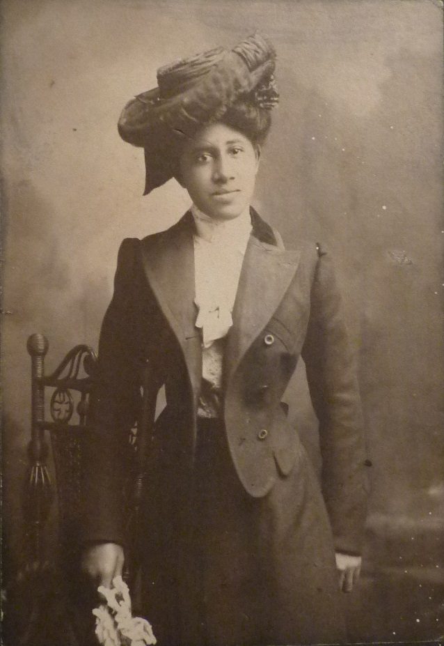 African American woman in Edwardian outfit and hat