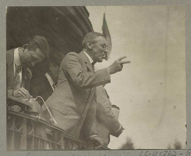 Woodrow Wilson making a peace sign